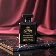 House of DaVoice Cherry Crown luxury cherry perfume displayed on black marble, perfumes similar to Tom Ford Lost Cherry