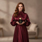 Woman holding House of DaVoice Cherry Crown perfume, perfumes like Lost Cherry Tom Ford with a luxurious cherry fragrance
