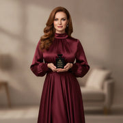 Woman holding House of DaVoice Cherry Crown perfume, perfumes like Lost Cherry Tom Ford with a luxurious cherry fragrance