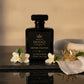 Crystal Solstice perfume 100 mL inspired by Baccarat Rouge perfume displayed on a black stone with gold crown
