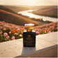 House of DaVoice Floral Attraction overlooking a sunset river valley, Luxury Women's Perfume, Good Girl Inspired Perfume by Carolina Herrera