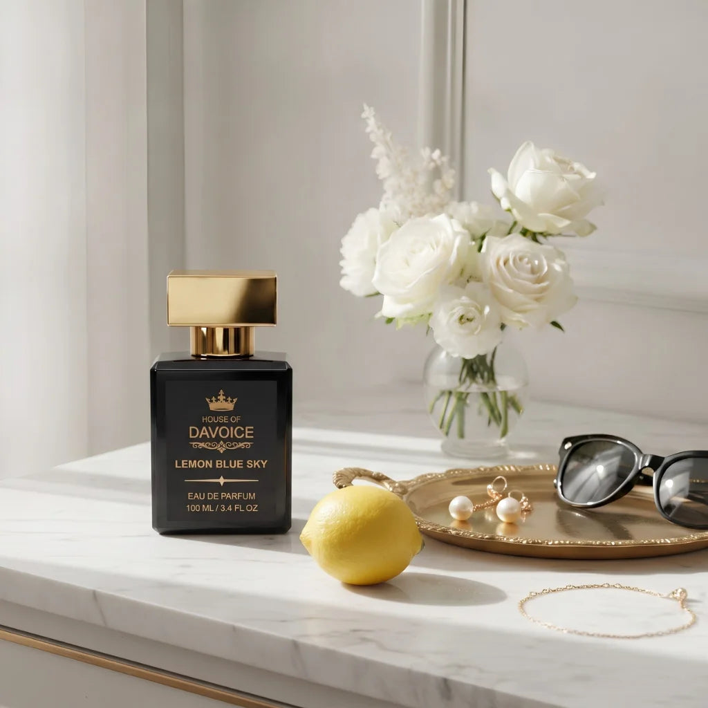 House of DaVoice Lemon Blue Sky Women's Citrus Perfume displayed on a luxury dresser with elegant accessories inspired by Dolce and Gabbana Light Blue Women's Perfume