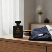 House of DaVoice Mountain Wind Sauvage dupe sitting beside a navy blazer and men's accessories