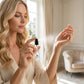 Woman testing a perfume sample from House of DaVoice